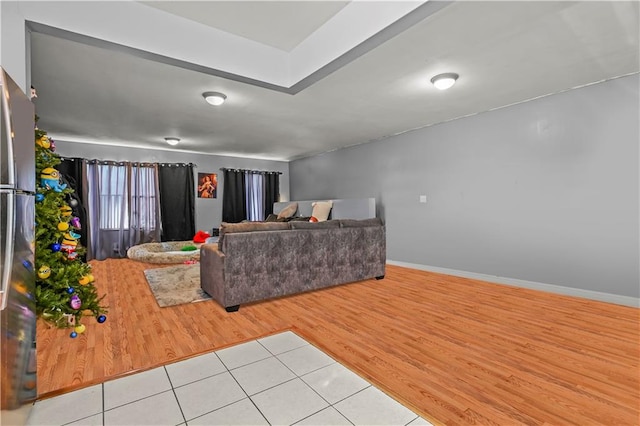 living room featuring wood finished floors and baseboards