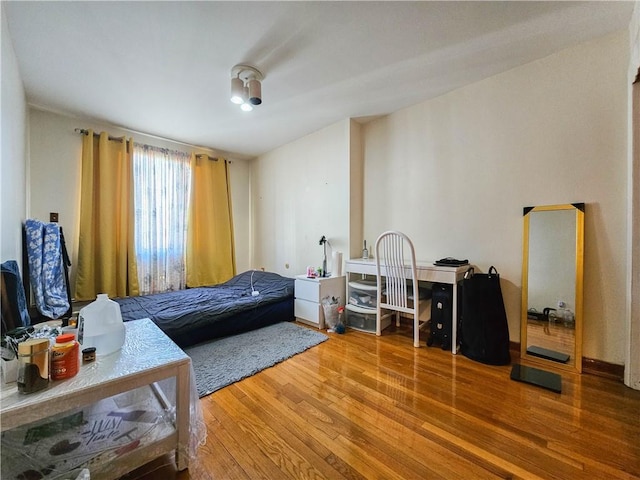 bedroom with wood finished floors