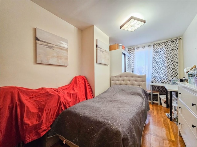 bedroom featuring wood finished floors