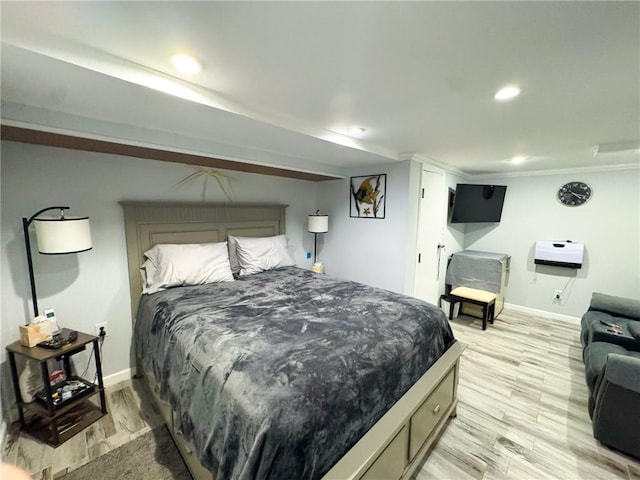 bedroom featuring recessed lighting, light wood-style flooring, and baseboards