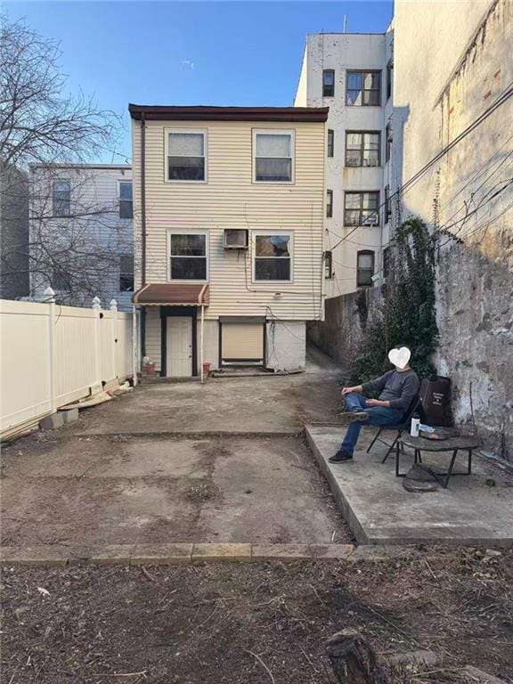 back of house with a patio and a fenced backyard