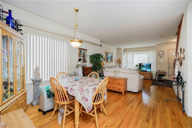 dining area featuring light wood-type flooring