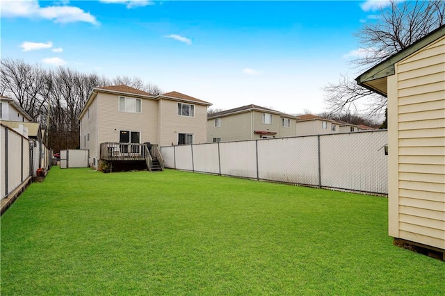 view of yard featuring a deck and a fenced backyard