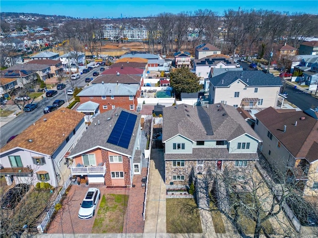 birds eye view of property with a residential view