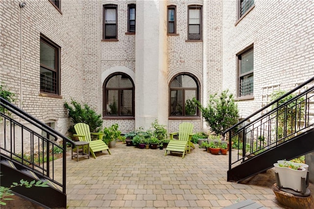 view of patio / terrace featuring stairs