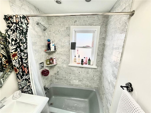 bathroom featuring shower / bathtub combination with curtain