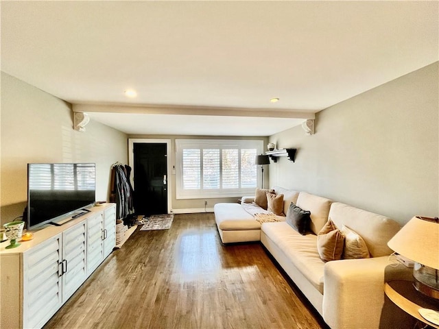 living area with recessed lighting and wood finished floors