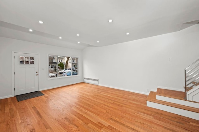 interior space with light wood finished floors, visible vents, stairway, lofted ceiling, and recessed lighting