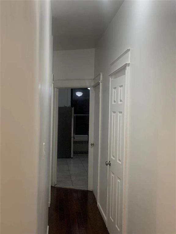 hallway with wood finished floors