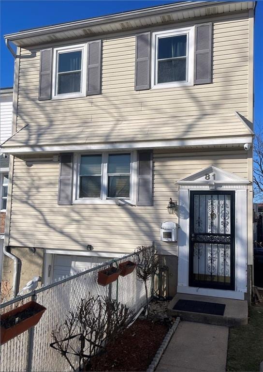 view of front of home with fence