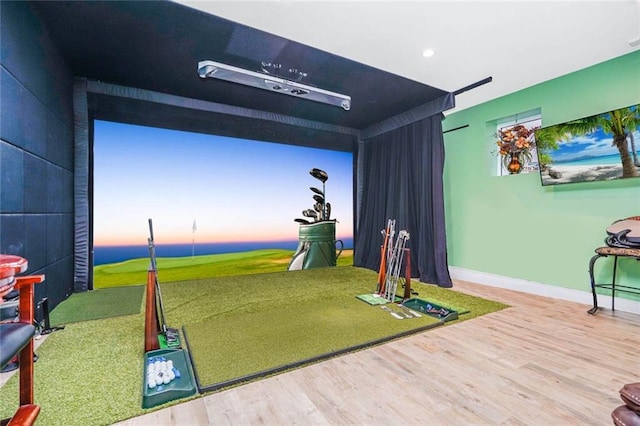 playroom featuring recessed lighting, baseboards, golf simulator, and wood finished floors