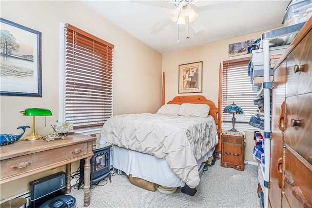 bedroom with ceiling fan and carpet floors