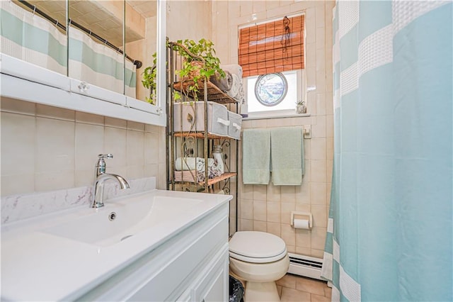 bathroom featuring tile patterned flooring, a baseboard heating unit, toilet, a shower with curtain, and tile walls