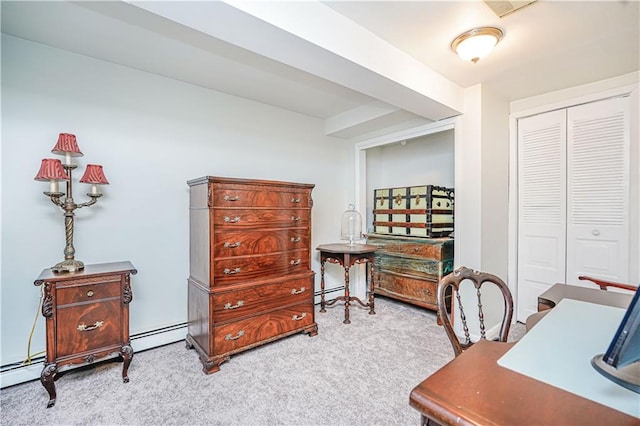 office with a baseboard heating unit and carpet floors