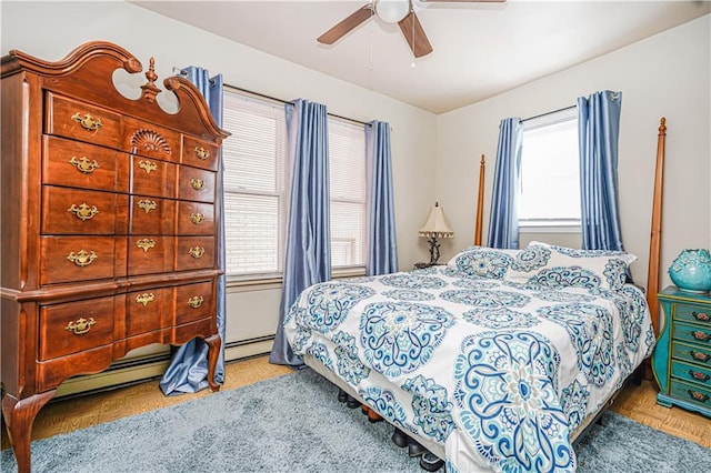 bedroom featuring baseboard heating and ceiling fan