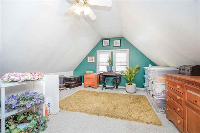 carpeted home office with baseboards, lofted ceiling, and a ceiling fan