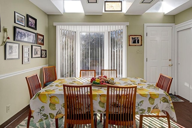 dining area with wood finished floors