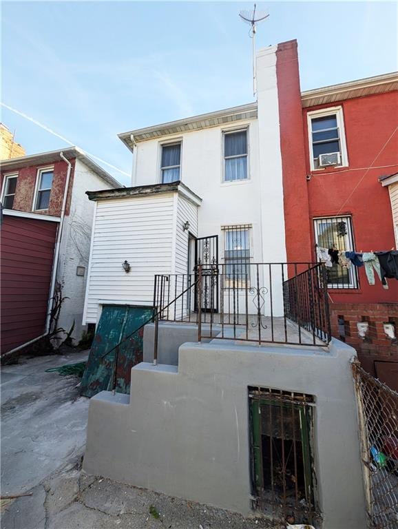 rear view of house with stucco siding