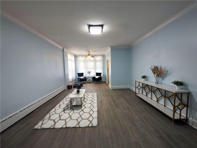 living area featuring baseboard heating, crown molding, baseboards, and wood finished floors