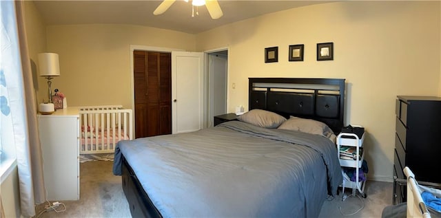 carpeted bedroom with a closet and ceiling fan