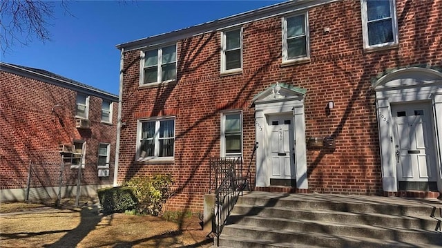 view of front of house with brick siding