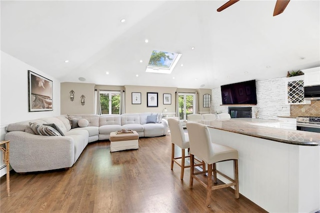 384 N Railroad Ave, Staten Island, NY 10304 - living area featuring a ceiling fan, a skylight, and wood finished floors