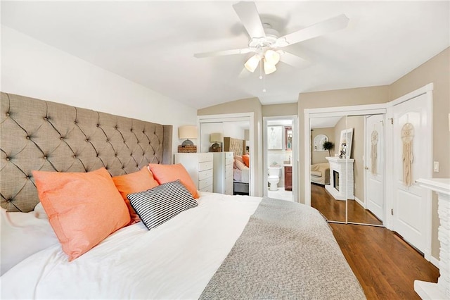 384 N Railroad Ave, Staten Island, NY 10304 - bedroom with wood finished floors, two closets, ceiling fan, connected bathroom, and vaulted ceiling