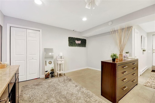 interior space with a closet, baseboards, recessed lighting, a baseboard heating unit, and light tile patterned floors