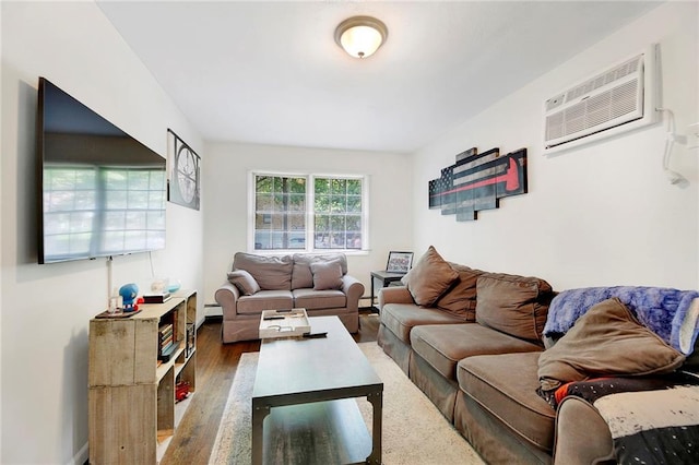 living room with wood finished floors, a baseboard heating unit, and a wall mounted AC