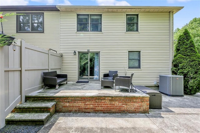 back of house featuring a patio, central AC, and fence