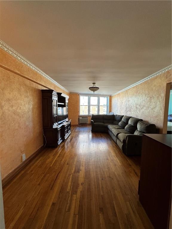 living area with dark wood-style floors and a textured wall