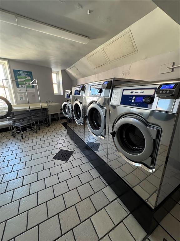 shared laundry with washer and clothes dryer