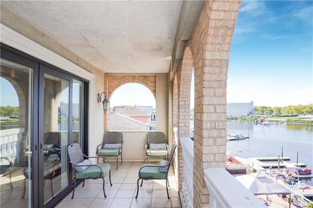 balcony featuring a water view