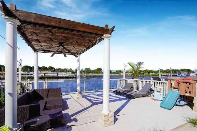 view of patio featuring a water view and ceiling fan