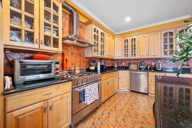 kitchen with a toaster, ornamental molding, glass insert cabinets, appliances with stainless steel finishes, and wall chimney exhaust hood