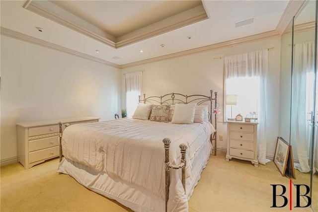 bedroom featuring light colored carpet, baseboards, crown molding, and a tray ceiling