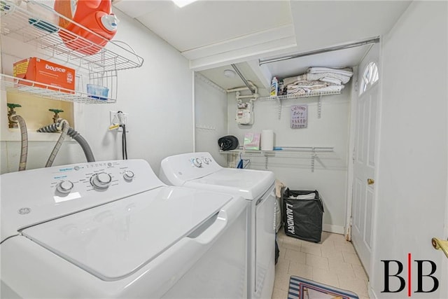 washroom featuring laundry area and washer and clothes dryer