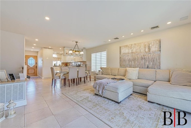 living room featuring light tile patterned floors, visible vents, and recessed lighting