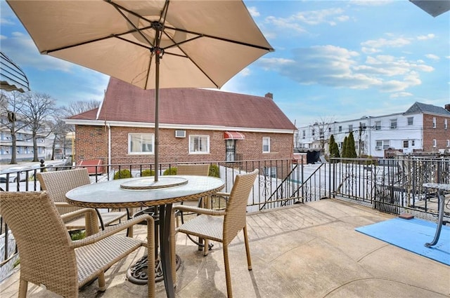 view of patio featuring a residential view and outdoor dining space