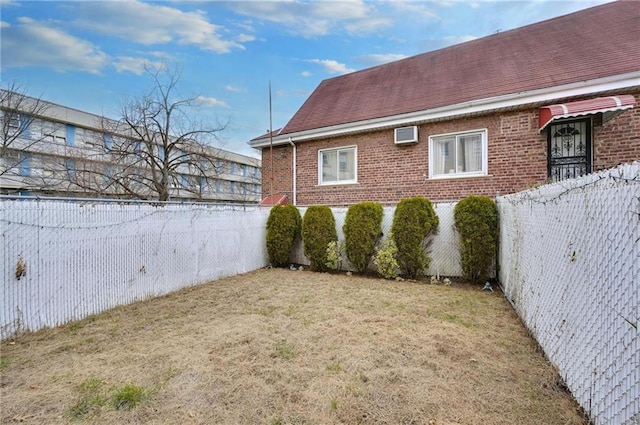 view of yard with a fenced backyard