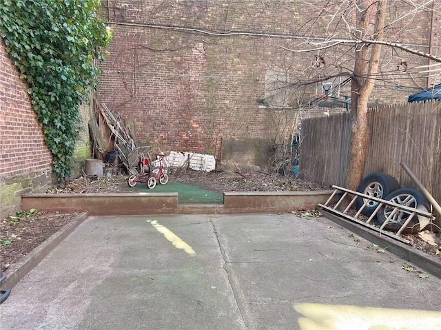 view of patio / terrace featuring fence