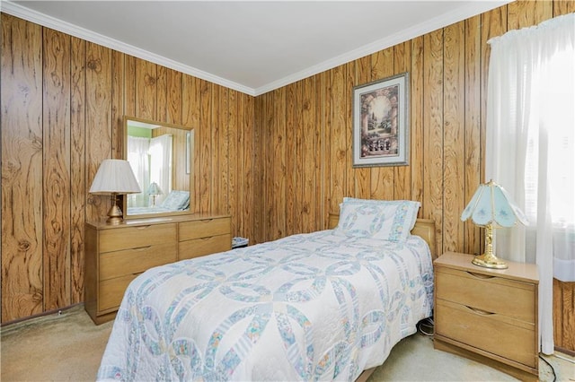 carpeted bedroom with wooden walls and crown molding