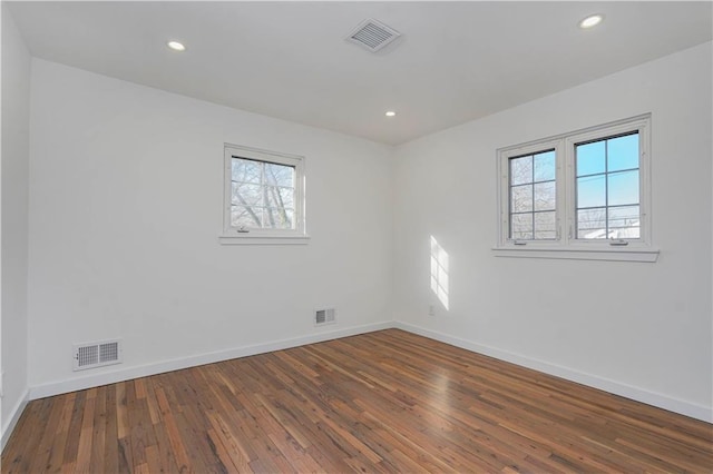 empty room with baseboards and visible vents