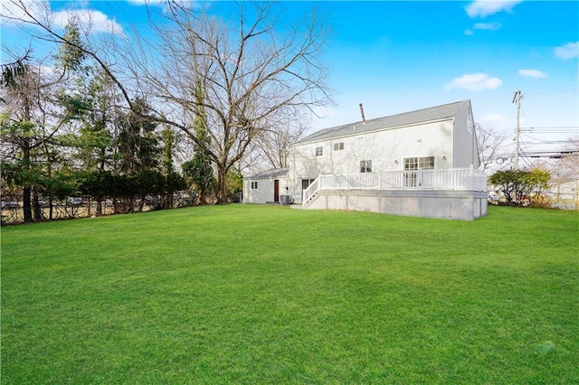 view of yard with a wooden deck