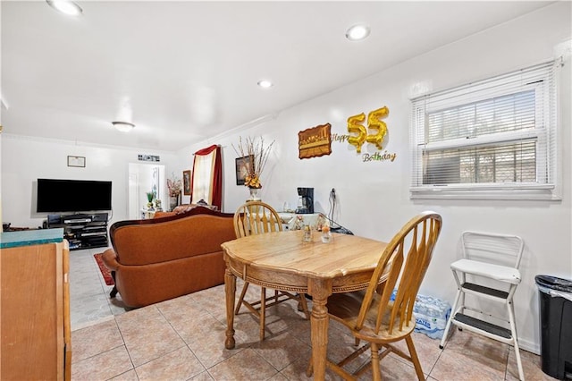 dining space featuring recessed lighting and light tile patterned floors