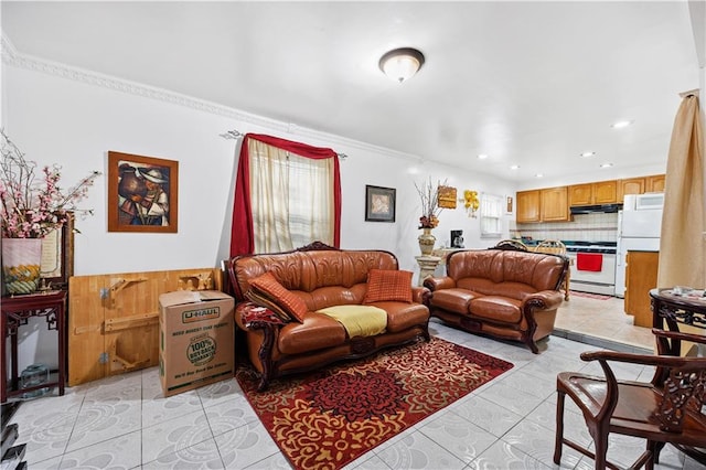 living area with light tile patterned floors and recessed lighting