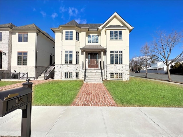 859 Lamont Ave, Staten Island, NY 10309 - view of front of home featuring a front yard, stone siding, and stucco siding