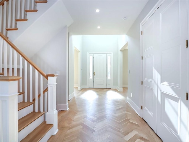 entryway featuring stairs, recessed lighting, and baseboards