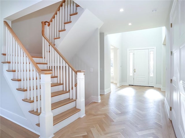 entryway featuring stairway, recessed lighting, and baseboards