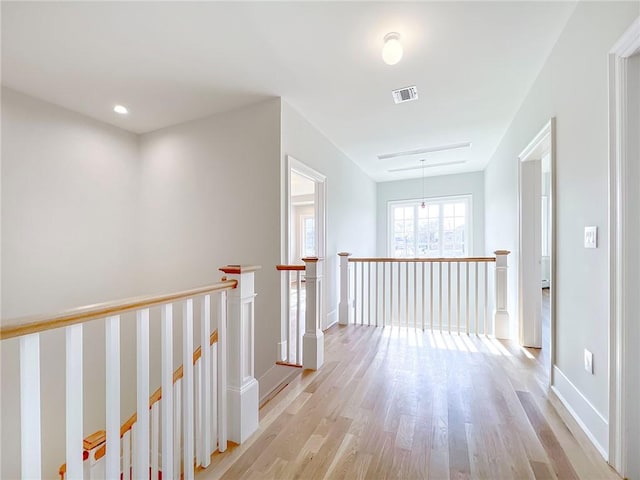 859 Lamont Ave, Staten Island, NY 10309 - hallway featuring an upstairs landing, light wood-style floors, and baseboards